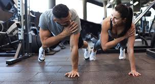Toning Bingo Wings: Your Ultimate Guide to Sculpting Sleek Arms at the Gym 3 Fitness trainer demonstrating arm toning exercises Isle of Isla