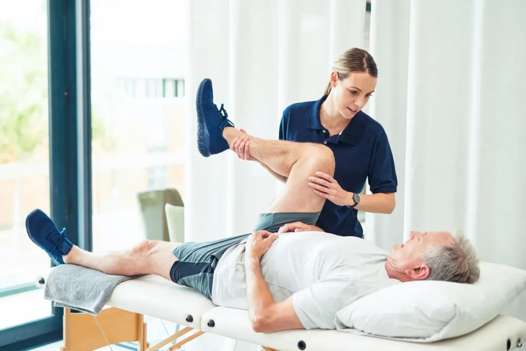 Revitalising Recovery: Effective Rehabilitation Strategies for Muscle Injuries 3 Physiotherapist assisting a patient with muscle recovery exercises Isle of Isla