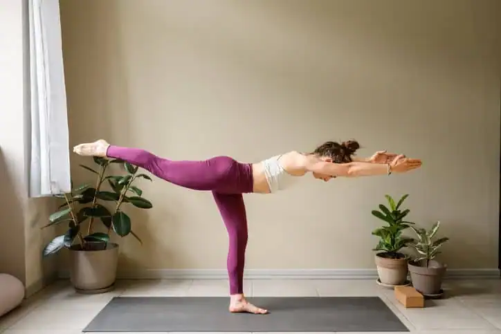 Achieving the Perfect Tone: How Often Should You Exercise for Results? 1 Woman doing Yoga exercise Isle of Isla to help with toning the body.