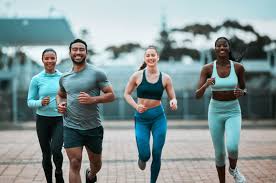 Sculpting Sleek Arms: The Essential Role of Cardio in Toning Without Bulking Up 3 image of people running to incorporate cardio Isle of Isla exercise into their life to help tone arms and body.